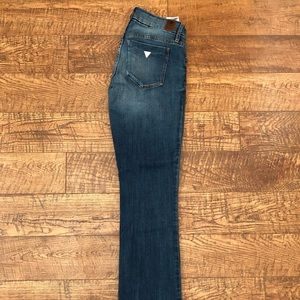 Guess jeans boot cut with holes. Mid rise